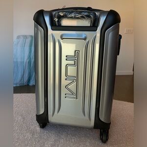 Tumi Silver Hard-Shell Spinner Carry-On with Black Accents